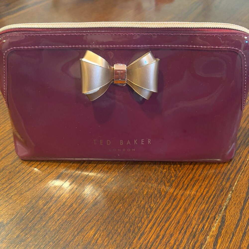 Ted Baker Gold Curve Bow Make up Cosmetic Bag in Oxblood